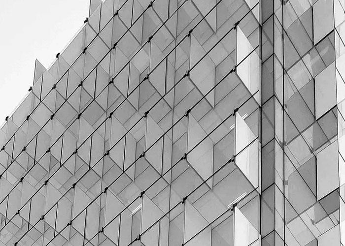 A robotic arm removing a plastic part from an injection molding machine